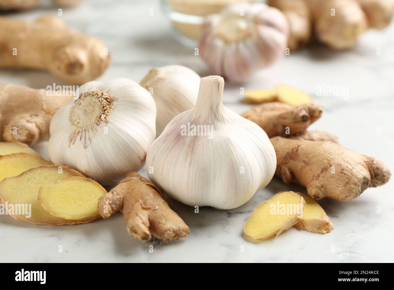 /storage/photos/30/ginger-and-fresh-garlic-on-table-natural-cold-remedies-2N24KCE.jpg